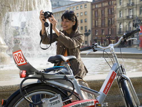 Woman with a Call a Bike bike